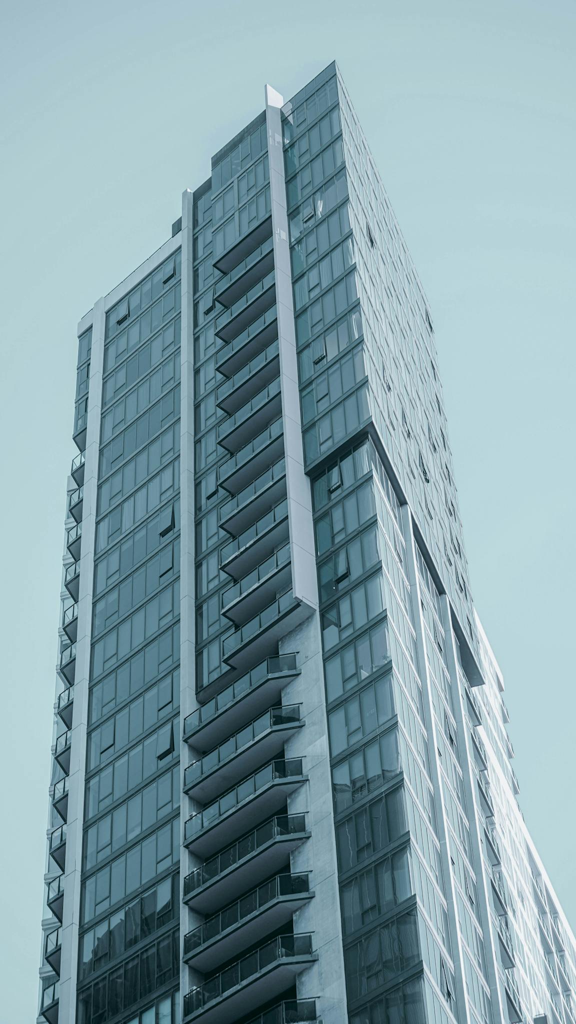 A Sleek High Rise Building Featuring A Modern