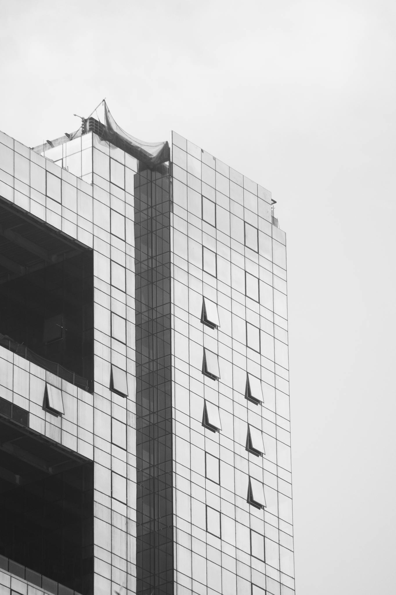 A Sleek Modern Skyscraper With A Reflective